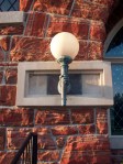 Hand holding lamp on library, Defiance, OH